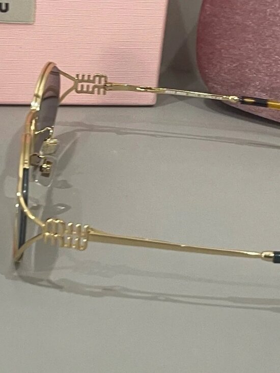 Miu Miu Oval Gold Frame Sunglasses